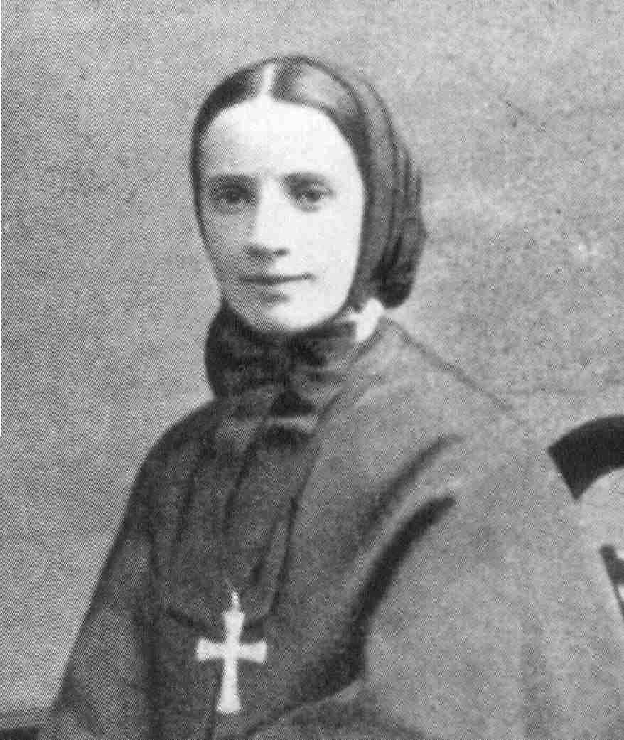 Black-and-white portrait of Mother Frances Xavier Cabrini in a dark religious habit with a white collar and a small cross