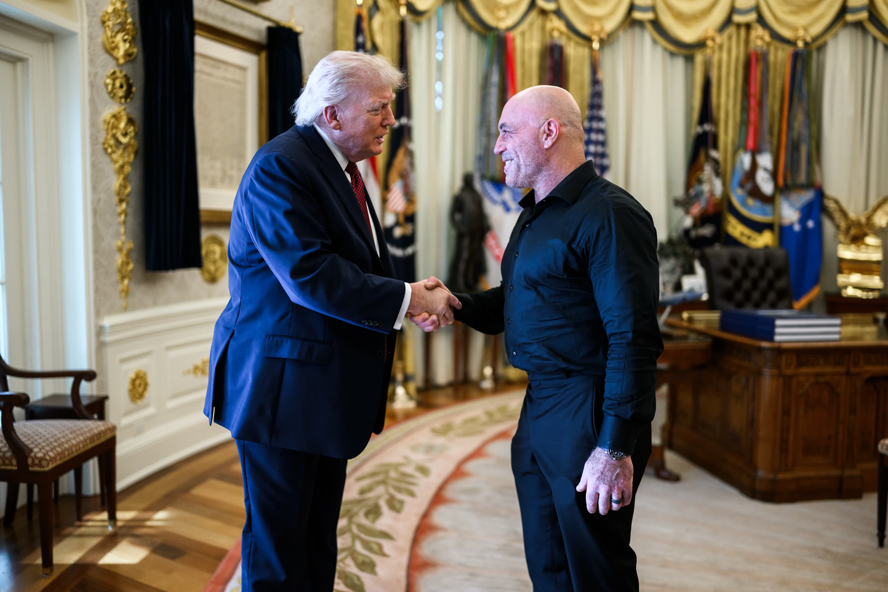 Joe Rogan speaking with President Donald Trump in the Oval Office