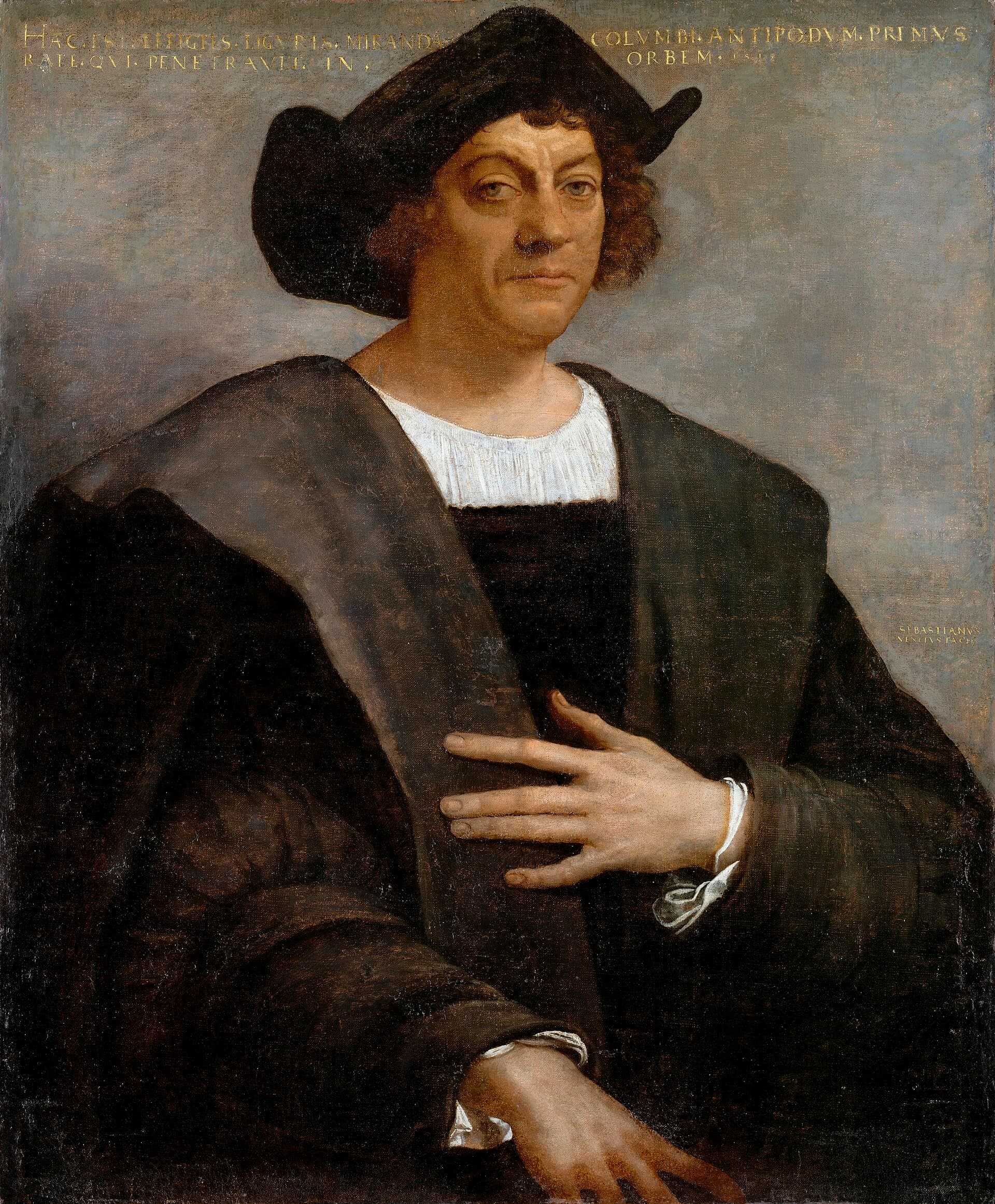 Renaissance oil portrait of a man in a dark cloak with his hand on his chest, traditionally identified as Christopher Columbus